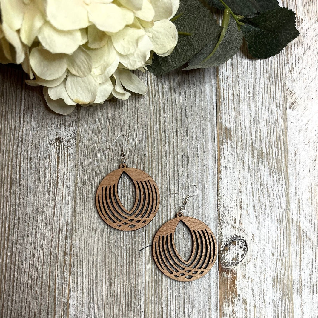 Lightweight Cherry Wood Intricate Circle Earrings on a board from Trumm and Co.