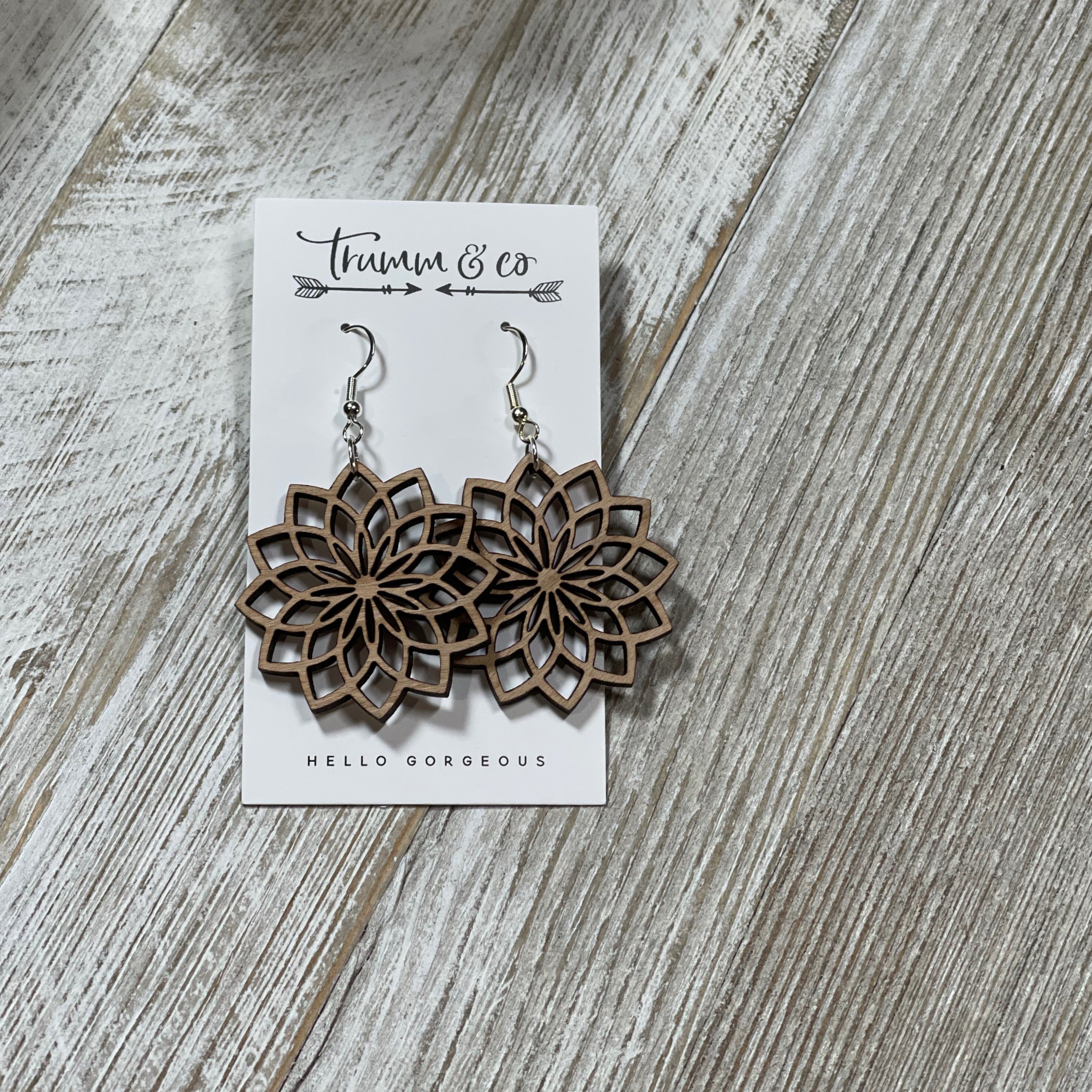 Laser cut metal earrings top