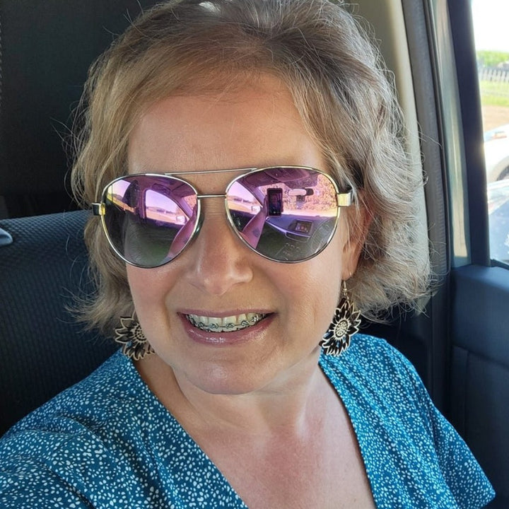 Customer and friend wearing the wood sunflower earrings by Trumm and Co in style
